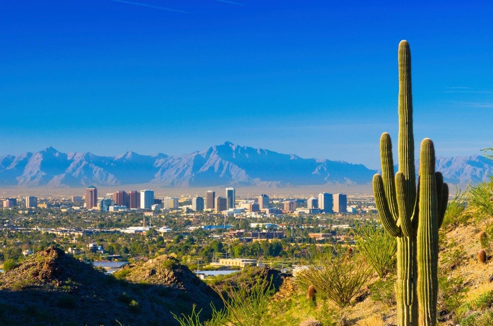 Phoenix skyline at sunset, where Housing Done Wright offers rooms for rent